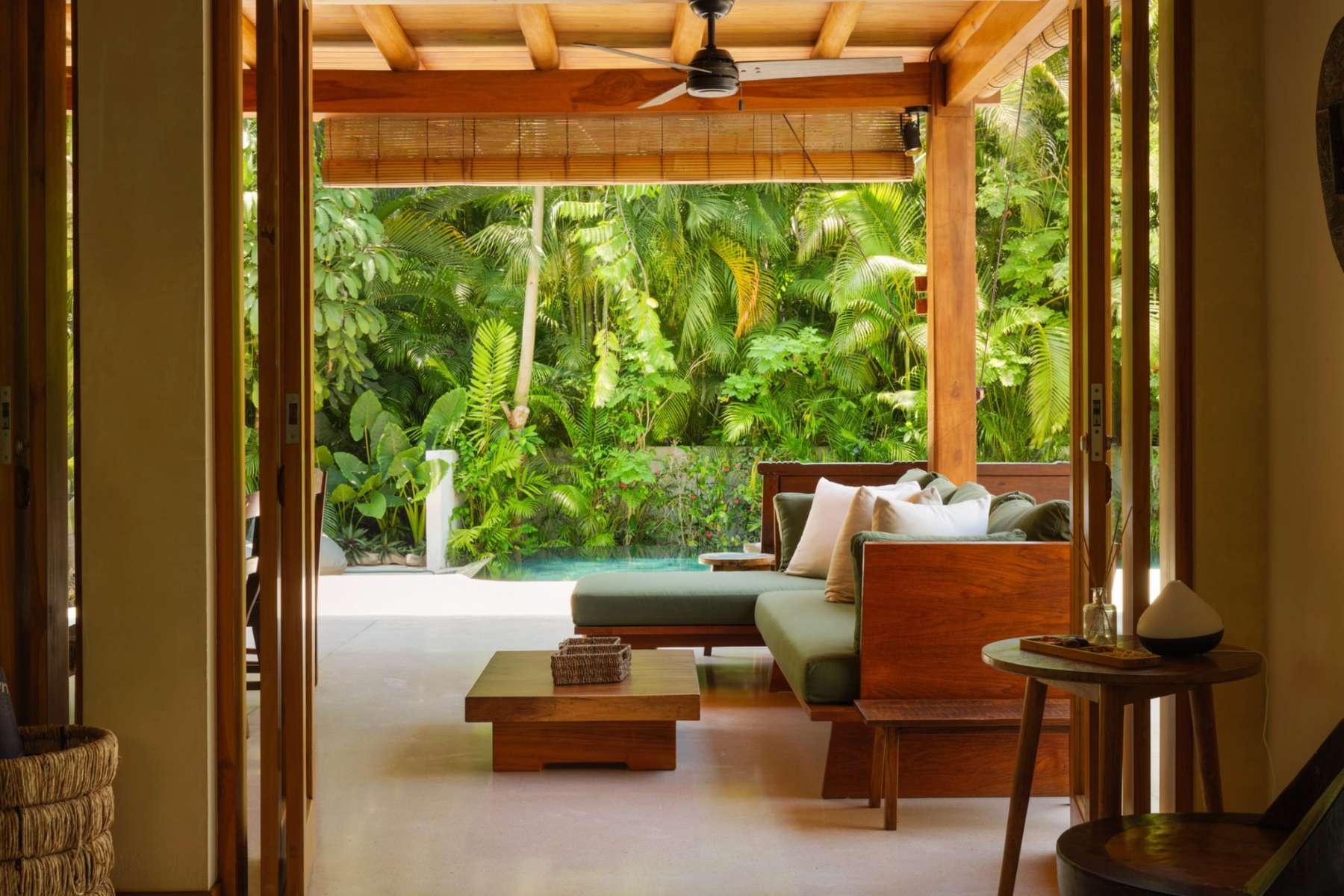 Living room opening to the pool and jungle