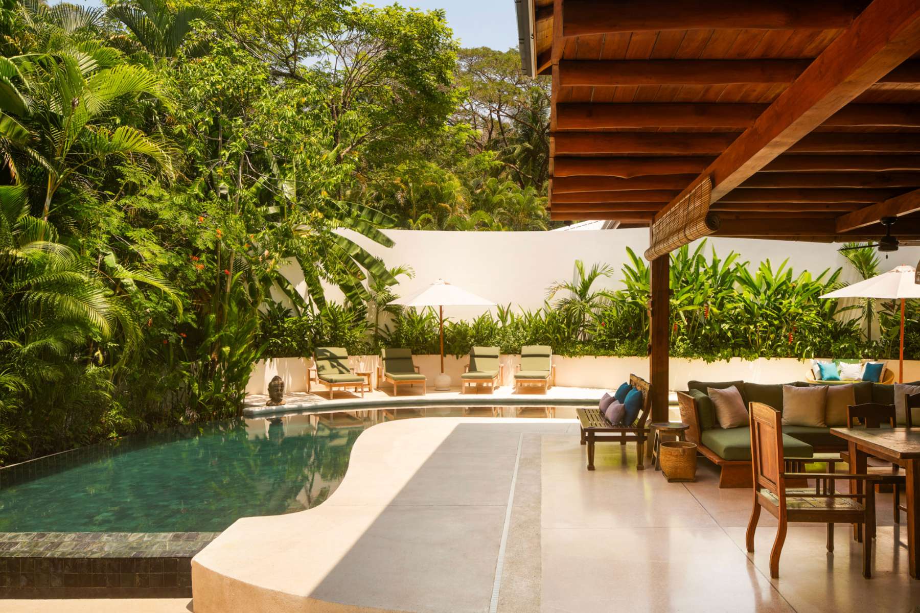 Pool deck with loungers and open-air lounge